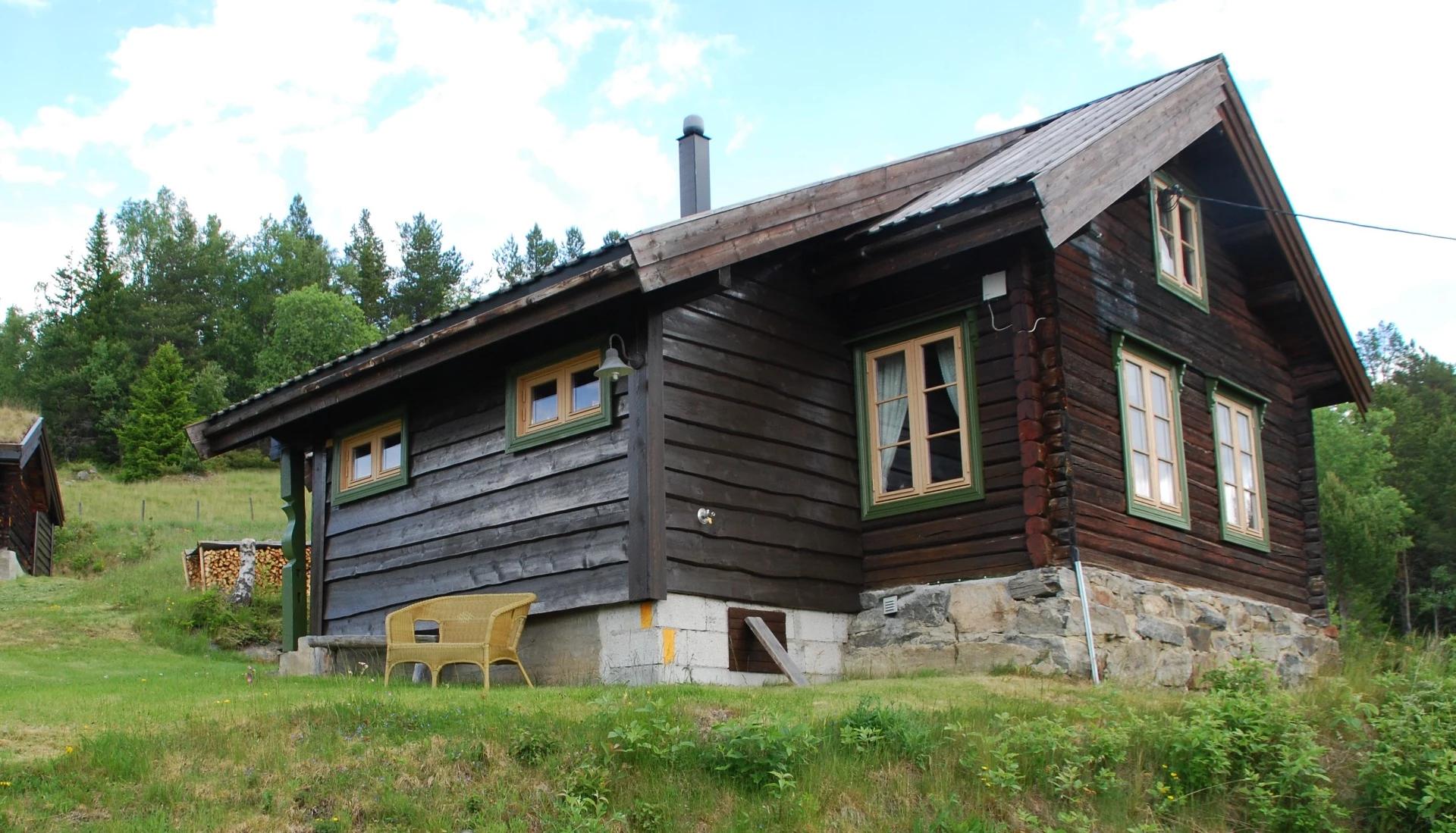 An old log house on a stone foundation